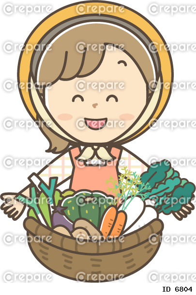 収穫した野菜を見せる女性